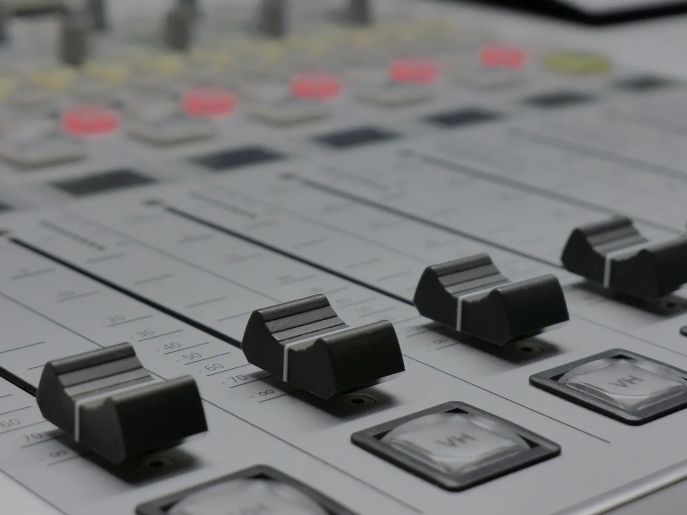 Close-up of an audio mixing board used for worship sound