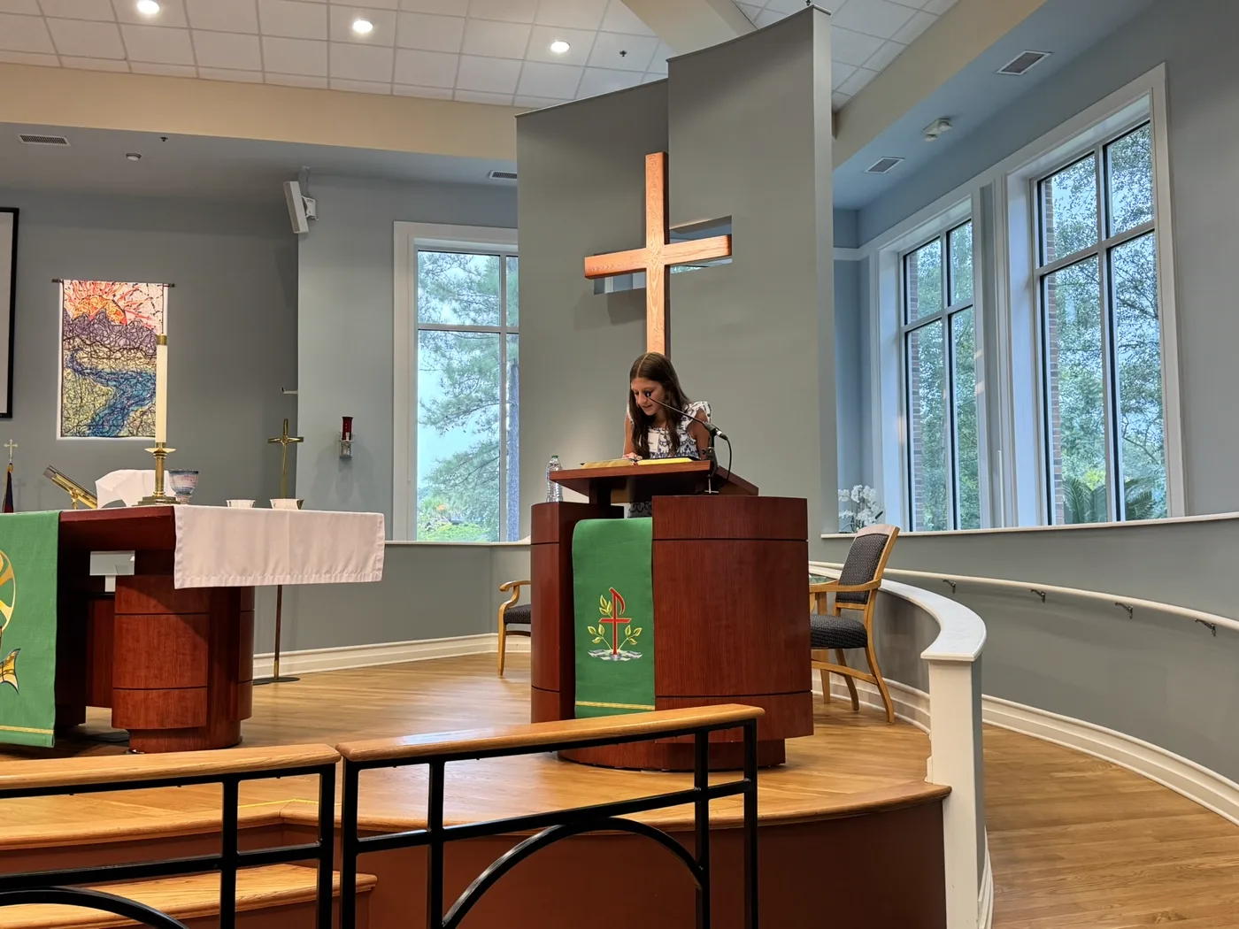 A young girl reading Scripture at the lectern during a service at Christ Church Bluffton
